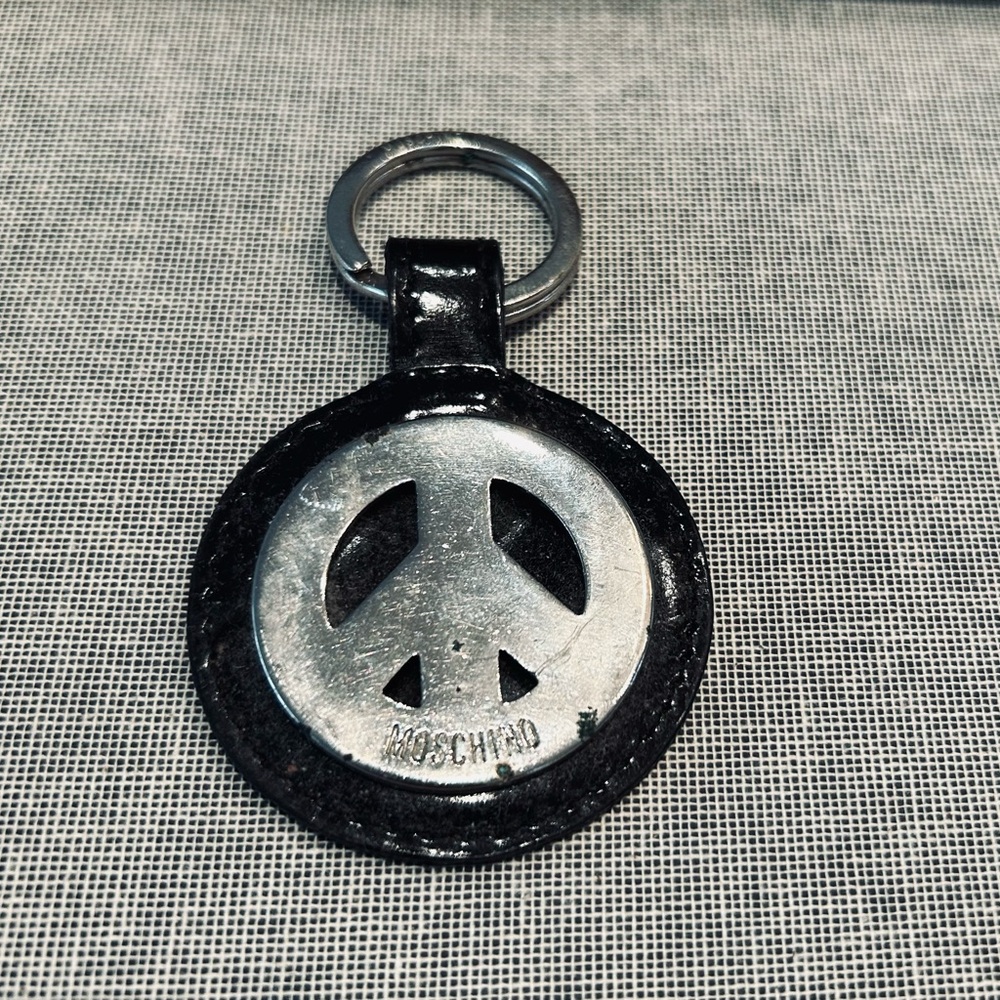 Moschino Black and Silver Peace Emblem Keychain